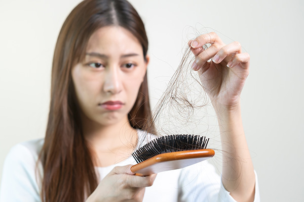girl facing hair loss